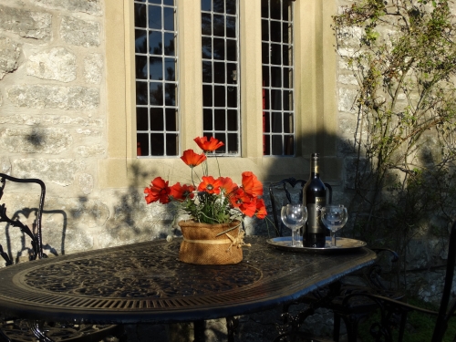 Poppies and sherry served in the cottage's garden